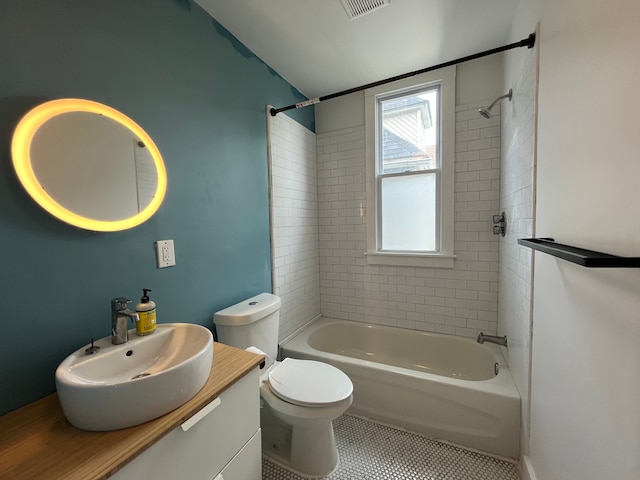2563 Canton St, Detroit, MI 48207 - bathroom featuring visible vents, toilet, tile patterned floors, vanity, and shower / bath combination