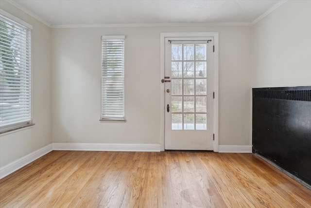 5784 Whittier St, Detroit, MI 48224 - entryway with crown molding, light wood finished floors, and baseboards