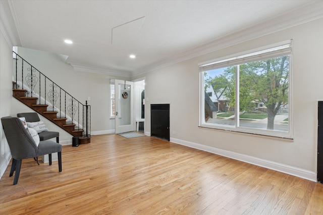 5784 Whittier St, Detroit, MI 48224 - unfurnished living room with light wood-type flooring, crown molding, and baseboards