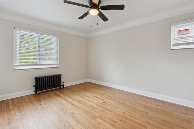 5784 Whittier St, Detroit, MI 48224 - unfurnished room featuring radiator, ceiling fan, light wood-type flooring, crown molding, and baseboards