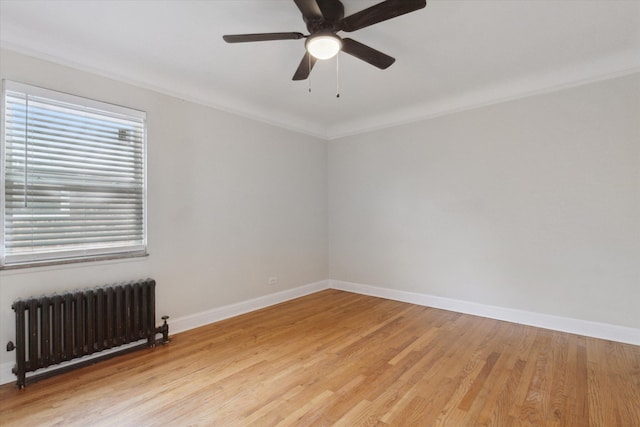 5784 Whittier St, Detroit, MI 48224 - unfurnished room featuring radiator, light wood-style flooring, and baseboards