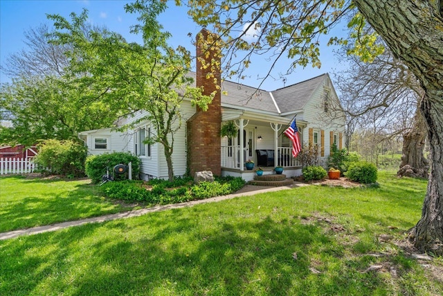 3440 Crandall Rd, Howell, MI 48855 - view of front facade featuring a porch and a chimney