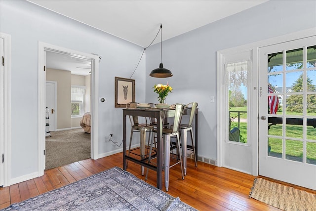 3440 Crandall Rd, Howell, MI 48855 - dining space featuring hardwood / wood-style floors and baseboards
