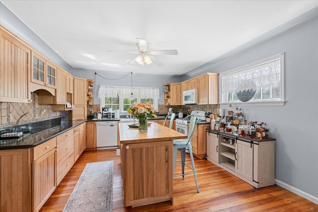 3440 Crandall Rd, Howell, MI 48855 - kitchen with white appliances, open shelves, a ceiling fan, a center island, and tasteful backsplash