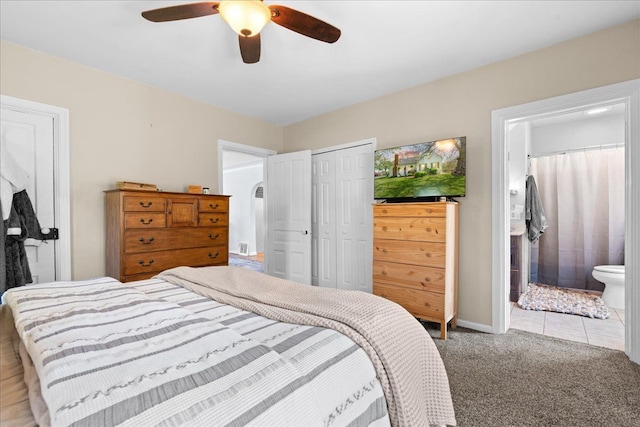 3440 Crandall Rd, Howell, MI 48855 - bedroom featuring light carpet, a closet, ensuite bathroom, ceiling fan, and baseboards
