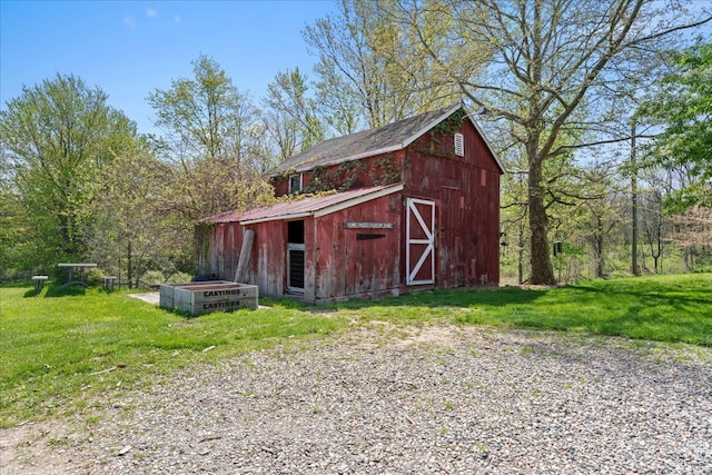 3440 Crandall Rd, Howell, MI 48855 - view of barn with a lawn