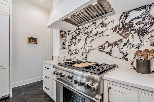 557 Greenwood Ave SE, East Grand Rapids, MI 49506 - kitchen with light countertops, backsplash, white cabinetry, high end stainless steel range oven, and custom range hood