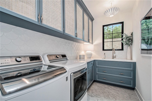 557 Greenwood Ave SE, East Grand Rapids, MI 49506 - washroom with marble finish floor, separate washer and dryer, cabinet space, and a sink