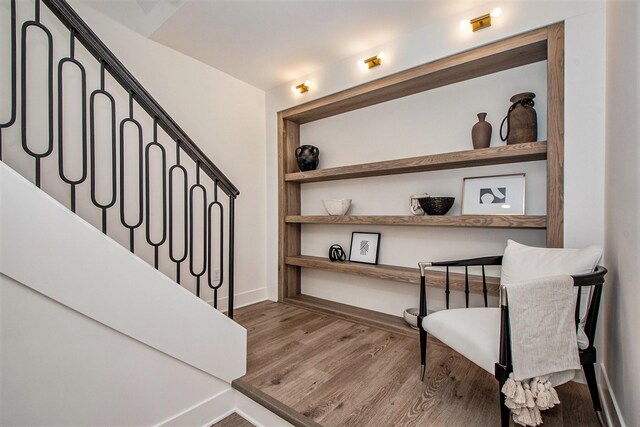 557 Greenwood Ave SE, East Grand Rapids, MI 49506 - stairs with wood finished floors and built in shelves