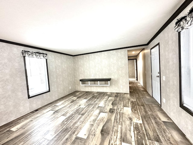3502 Beech Ln, Twin Lake, MI 49457 - empty room with dark wood-style flooring and crown molding