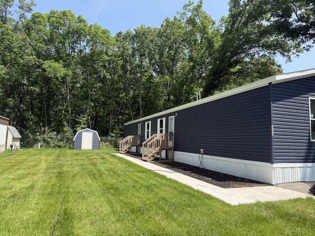 3502 Beech Ln, Twin Lake, MI 49457 - view of yard featuring a storage unit
