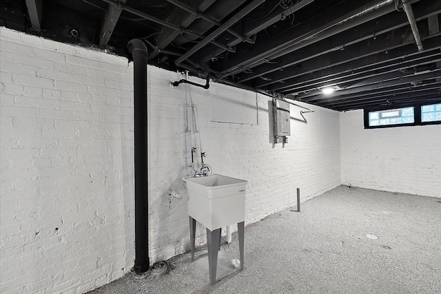 basement featuring electric panel