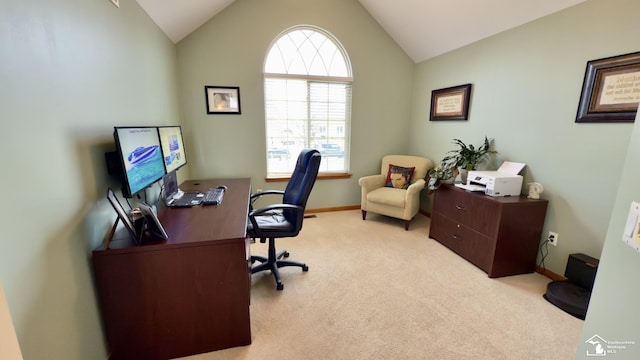 carpeted office featuring baseboards and vaulted ceiling