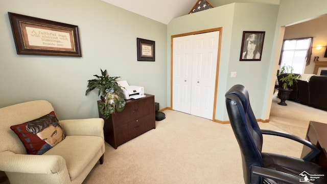carpeted office with baseboards and vaulted ceiling