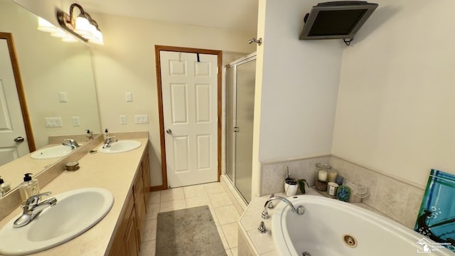 bathroom featuring double vanity, a sink, a jetted tub, and a stall shower