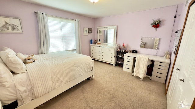bedroom featuring light colored carpet