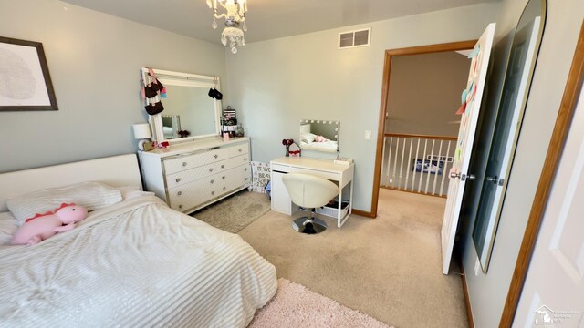 bedroom featuring light carpet, baseboards, and visible vents