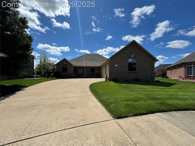 56098 Walker Ct, Macomb, MI 48042 - single story home featuring driveway, a front yard, brick siding, and a garage