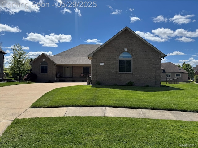 56098 Walker Ct, Macomb, MI 48042 - view of front of home featuring brick siding and a front lawn