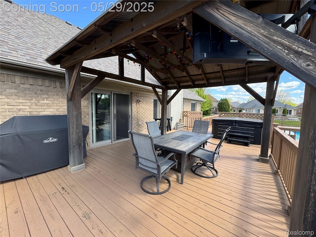 56098 Walker Ct, Macomb, MI 48042 - wooden deck featuring outdoor dining space, a gazebo, and a hot tub