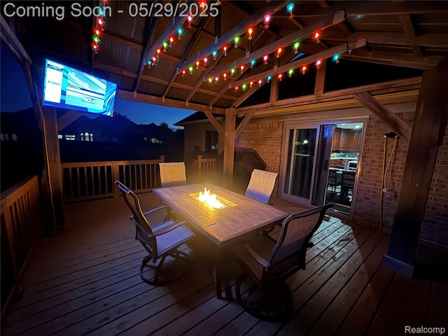 56098 Walker Ct, Macomb, MI 48042 - wooden terrace with an outdoor fire pit