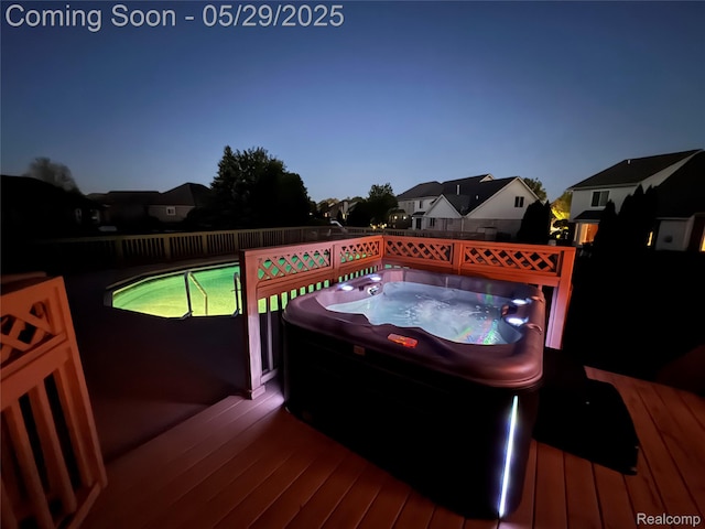 56098 Walker Ct, Macomb, MI 48042 - wooden terrace featuring a hot tub and a fenced backyard