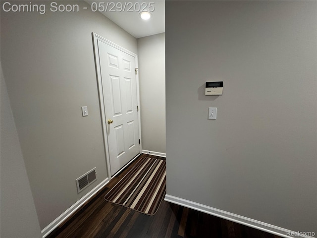 56098 Walker Ct, Macomb, MI 48042 - hallway with dark wood-type flooring and baseboards