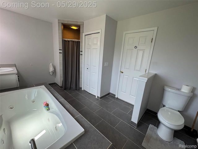 56098 Walker Ct, Macomb, MI 48042 - bathroom with toilet, a tub with jets, tile patterned flooring, and baseboards