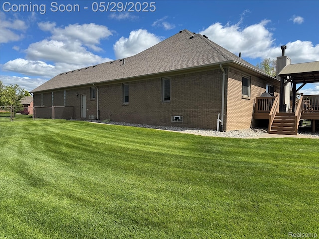 56098 Walker Ct, Macomb, MI 48042 - rear view of house with a gazebo, a wooden deck, brick siding, and a yard