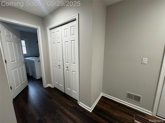 56098 Walker Ct, Macomb, MI 48042 - corridor with separate washer and dryer, dark wood finished floors, and baseboards