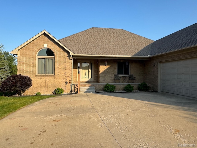 56098 Walker Ct, Macomb, MI 48042 - single story home featuring brick siding, concrete driveway, a porch, roof with shingles, and a garage