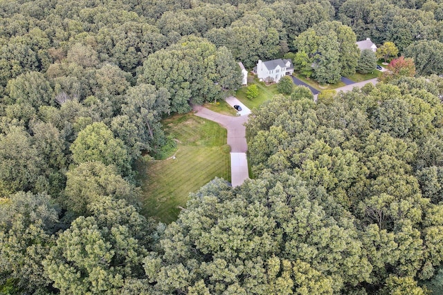 aerial view featuring a wooded view