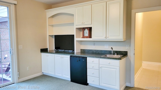 2004 Timberview Dr, Okemos, MI 48864 - kitchen featuring open shelves, dishwashing machine, a sink, and dark countertops