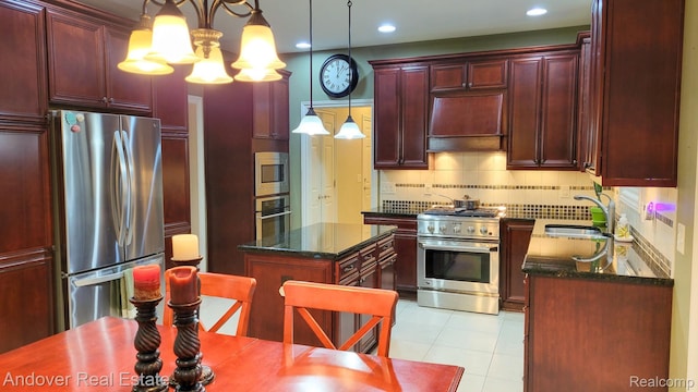 2004 Timberview Dr, Okemos, MI 48864 - kitchen featuring stainless steel appliances, dark brown cabinets, a sink, a kitchen island, and tasteful backsplash