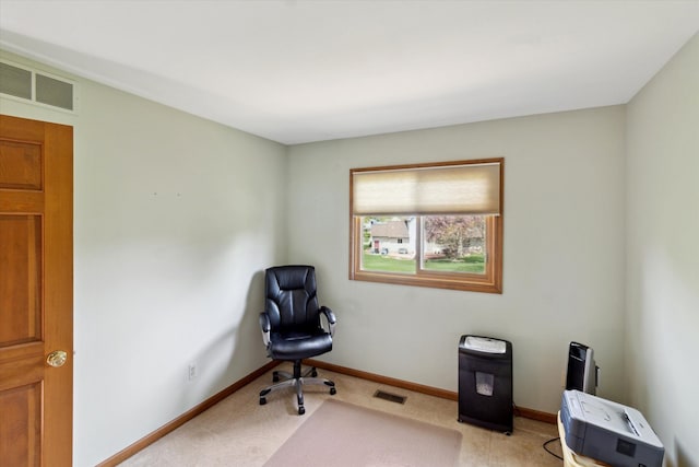 sitting room with visible vents, baseboards, and light colored carpet