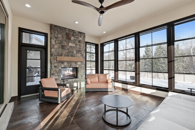 1044 Lakeside Dr, Birmingham, MI 48009 - living area with recessed lighting, a stone fireplace, and a ceiling fan
