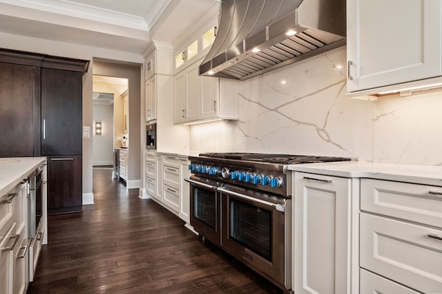 1044 Lakeside Dr, Birmingham, MI 48009 - kitchen with backsplash, crown molding, light stone countertops, wall chimney exhaust hood, and range with two ovens