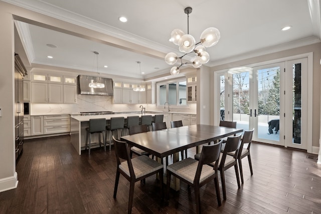 1044 Lakeside Dr, Birmingham, MI 48009 - dining room with a notable chandelier, dark wood-style floors, crown molding, recessed lighting, and french doors