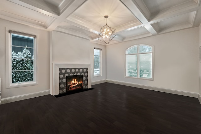 1044 Lakeside Dr, Birmingham, MI 48009 - unfurnished living room with baseboards, an inviting chandelier, dark wood-type flooring, coffered ceiling, and a tile fireplace
