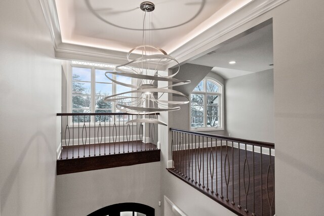 1044 Lakeside Dr, Birmingham, MI 48009 - stairs with a tray ceiling and a notable chandelier