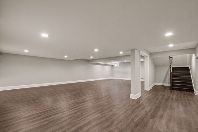 1044 Lakeside Dr, Birmingham, MI 48009 - finished basement with dark wood-type flooring, recessed lighting, baseboards, and stairway