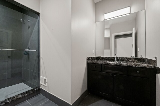 1044 Lakeside Dr, Birmingham, MI 48009 - full bath featuring a stall shower, vanity, and tile patterned flooring