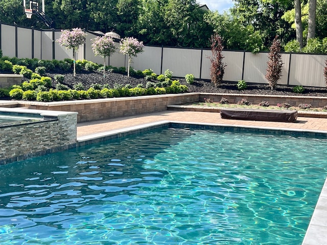 1044 Lakeside Dr, Birmingham, MI 48009 - view of swimming pool featuring a fenced in pool, fence, and a hot tub