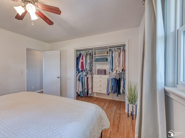 bedroom with light wood finished floors, a closet, and ceiling fan
