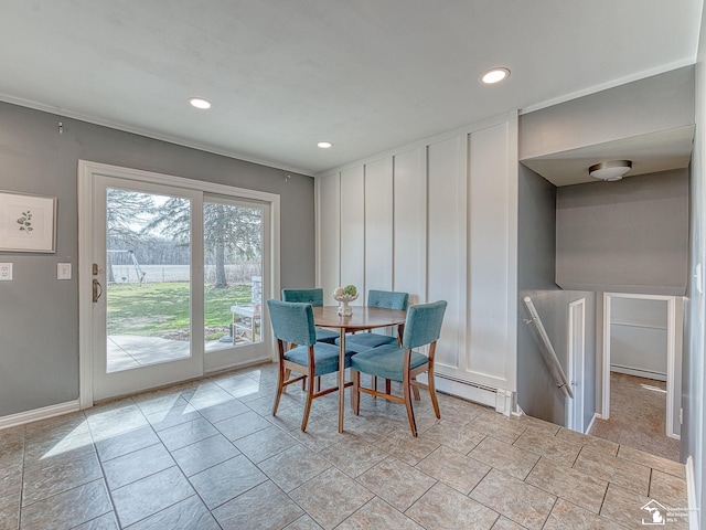 dining area with baseboards, recessed lighting, and a baseboard radiator
