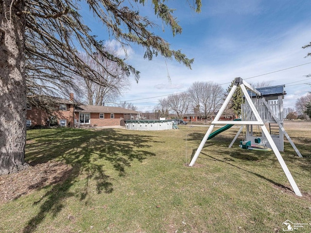 view of yard featuring a playground