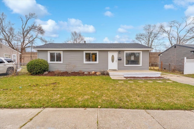 view of front of property with fence and a front yard