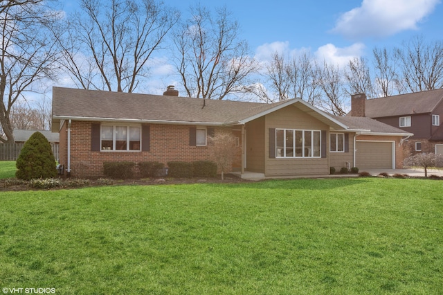 4129 Hailey Dr, Saint Joseph, MI 49085 - rear view of property with a chimney, an attached garage, driveway, brick siding, and a lawn