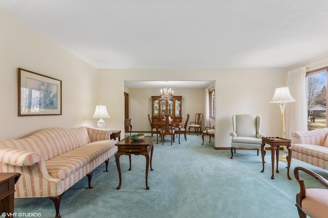 4129 Hailey Dr, Saint Joseph, MI 49085 - carpeted living room featuring wallpapered walls, a notable chandelier, and baseboards
