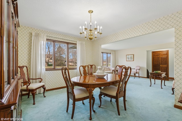 4129 Hailey Dr, Saint Joseph, MI 49085 - carpeted dining area with baseboards, a textured ceiling, wallpapered walls, and an inviting chandelier